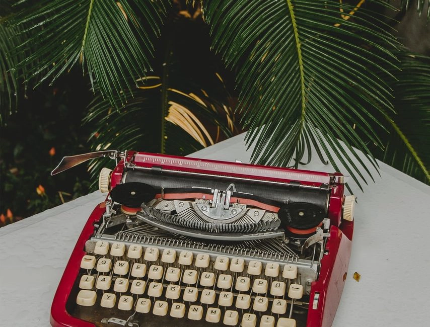 red and gray typewriter